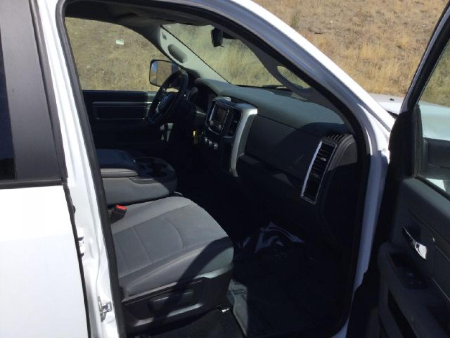 2016 Bright White /Diesel Grey/Black Ram 1500 SLT (1C6RR7LT7GS) with an HEMI 5.7L V-8 variable valve control engine, 8-Speed Automatic transmission, located at 1801 Main Street, Lewiston, 83501, (208) 743-9371, 46.417065, -117.004799- Photo#12