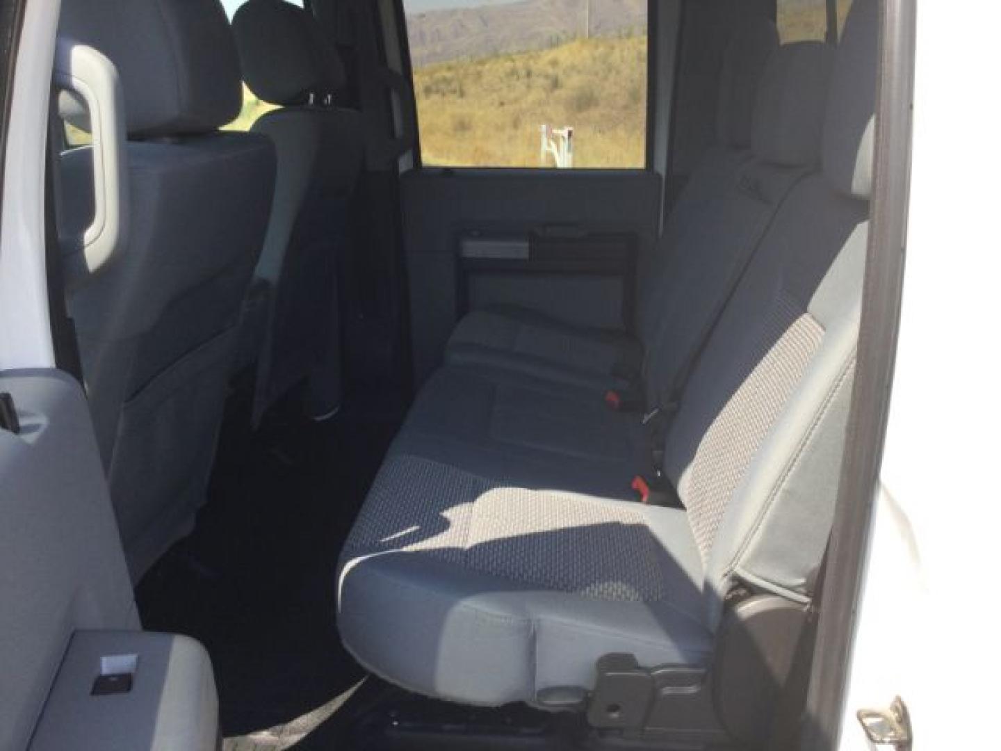 2015 Oxford White /Light Gray Leather Ford F-250 Crew Cab XLT 4x4 FX4 (1FT7W2B69FE) with an 6.2L V8 engine, 6-Speed Automatic transmission, located at 1801 Main Street, Lewiston, 83501, (208) 743-9371, 46.417065, -117.004799- Photo#16