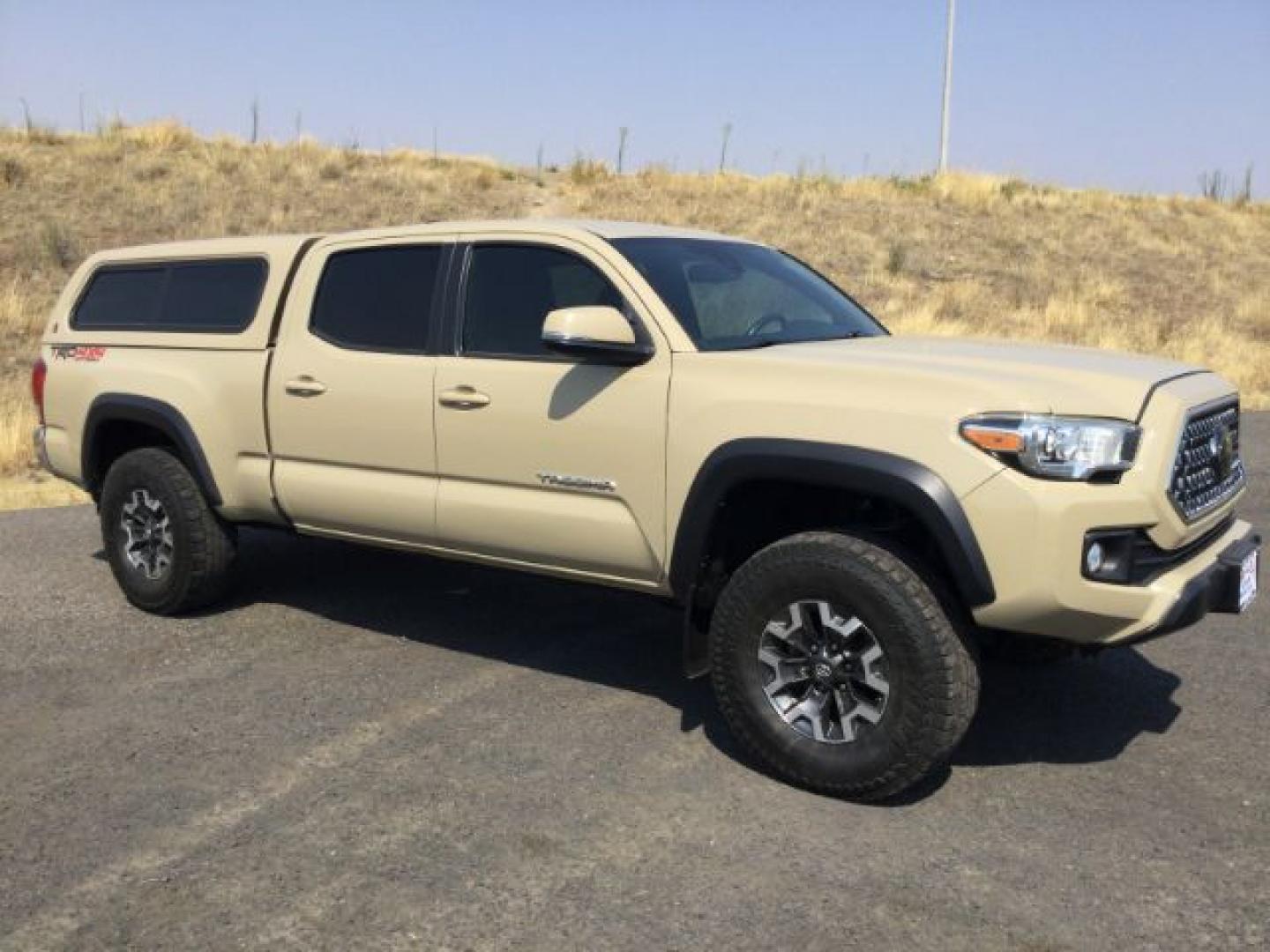 2018 Quicksand /Black/Gray Cloth Toyota Tacoma TRD Off Road (3TMDZ5BN3JM) with an 3.5L V-6 port/direct injection engine, 6-Speed Automatic transmission, located at 1801 Main Street, Lewiston, 83501, (208) 743-9371, 46.417065, -117.004799- Photo#1