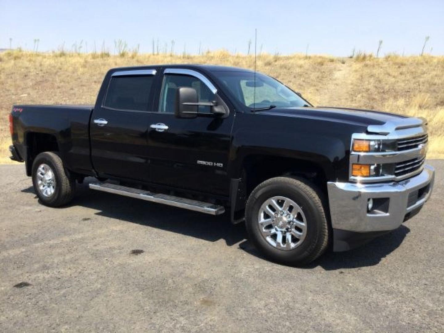2018 Black /Jet Black Chevrolet Silverado 2500HD Crew Cab LT 4WD (1GC1KUEG9JF) with an Vortec 6L V-8 variable valve control engine, 6-Speed Automatic transmission, located at 1801 Main Street, Lewiston, 83501, (208) 743-9371, 46.417065, -117.004799- Photo#0