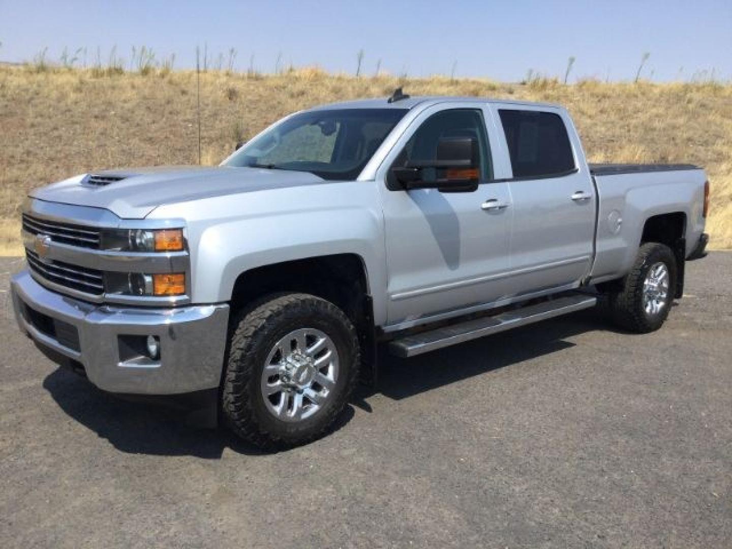 2018 Silver Ice Metallic /Jet Black Chevrolet Silverado 3500HD LT (1GC4KZCY4JF) with an Duramax 6.6L V-8 diesel direct injection engine, 6-Speed Automatic transmission, located at 1801 Main Street, Lewiston, 83501, (208) 743-9371, 46.417065, -117.004799- Photo#1
