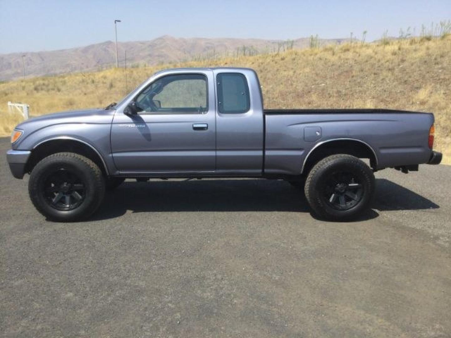 1997 LT BLUE /Gray Toyota Tacoma Base V6 (4TAWN72N6VZ) with an 3.4L V-6 DOHC engine, 5-Speed Manual Transmission transmission, located at 1801 Main Street, Lewiston, 83501, (208) 743-9371, 46.417065, -117.004799- Photo#2