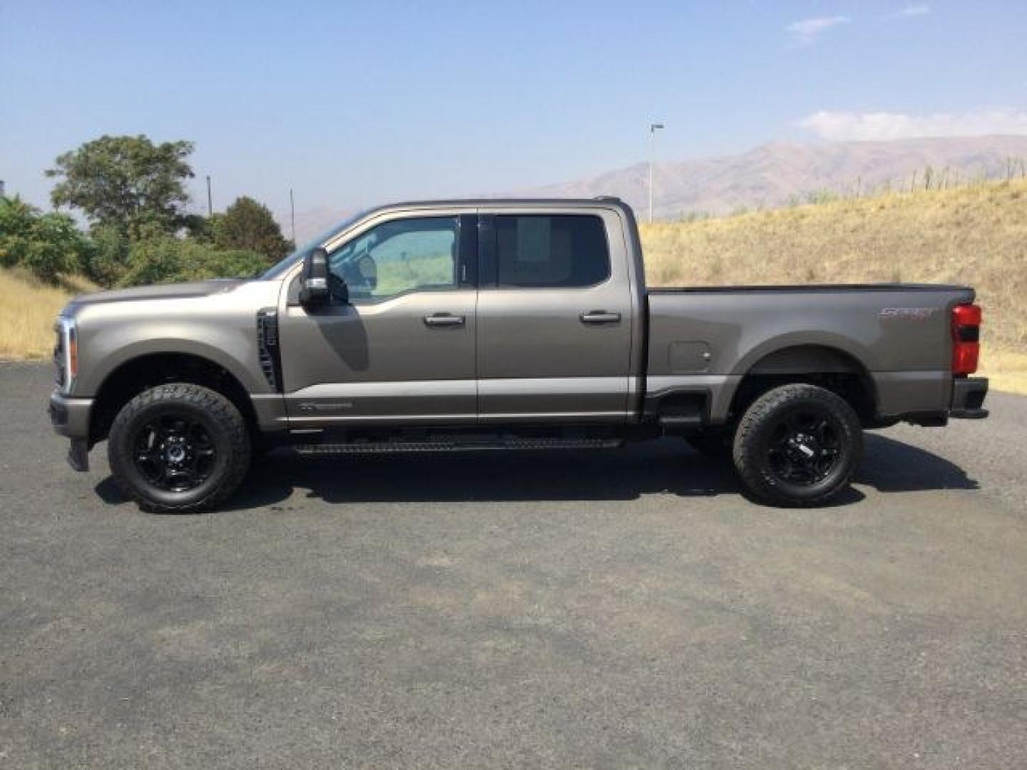 2023 Stone Grey Metallic /Medium Dark Slate Ford F-350 SD Crew Cab XLT 4x4 (1FT8W3BT9PE) with an 6.7L V8 OHV 16V DIESEL engine, 10 speed automatic transmission, located at 1801 Main Street, Lewiston, 83501, (208) 743-9371, 46.417065, -117.004799- Photo#2