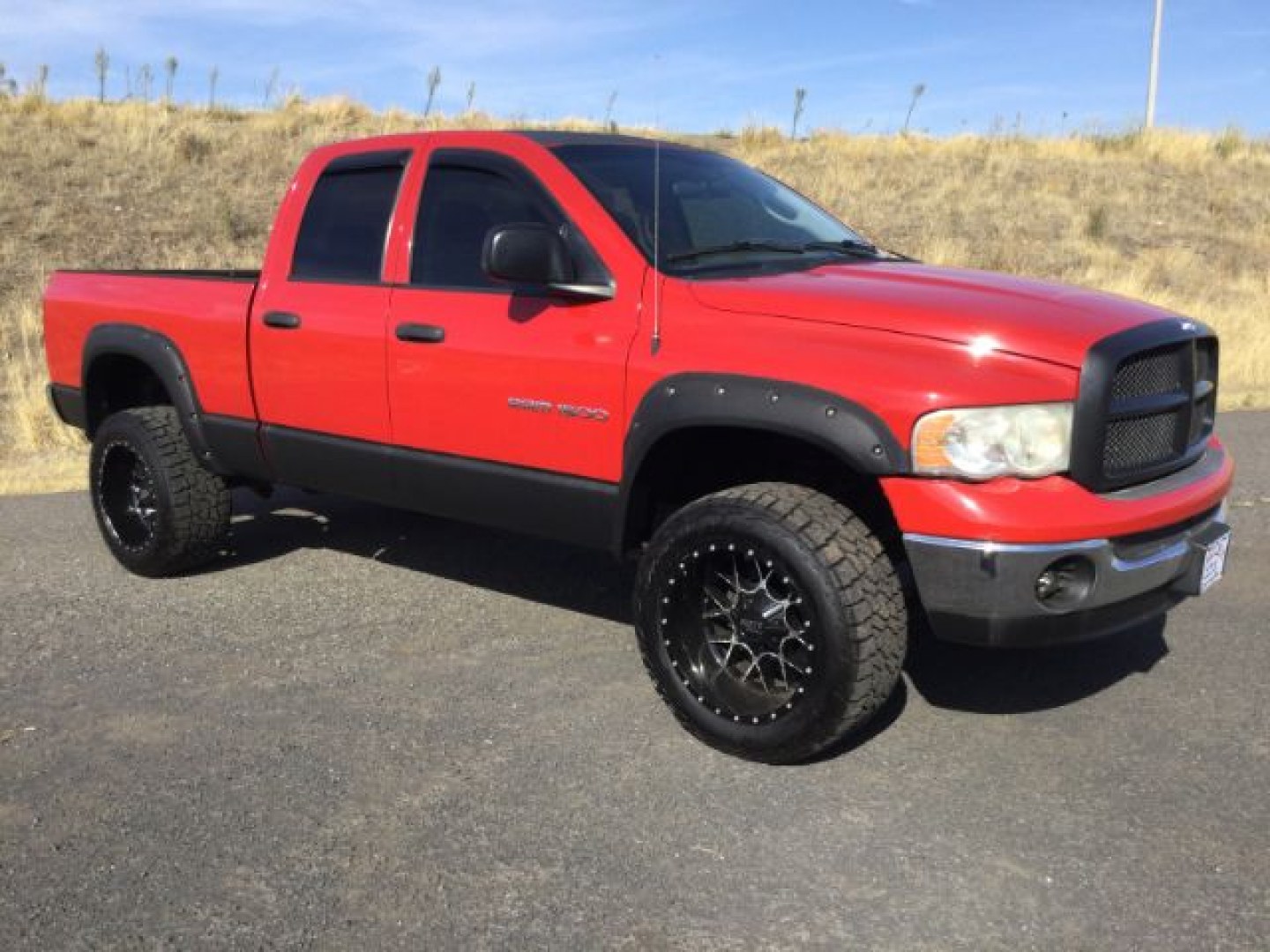 2005 Flame Red Clearcoat /Dark Slate Gray Dodge Ram 1500 SLT Quad Cab (1D7HU18D95S) with an HEMI Magnum 5.7L V-8 regular unleaded engine, 4 speed Automatic transmission, located at 1801 Main Street, Lewiston, 83501, (208) 743-9371, 46.417065, -117.004799- Photo#0