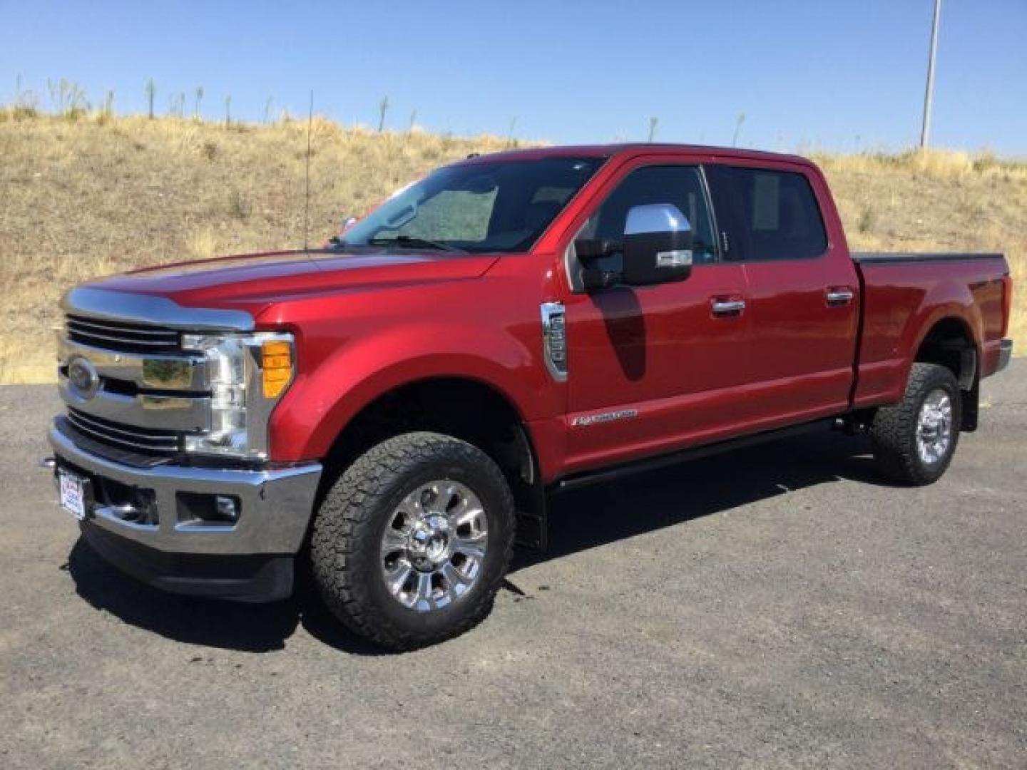 2017 Ruby Red Metallic Tinted Clearcoat /Black Ford F-350 LARIAT (1FT8W3BT7HE) with an Powerstroke 6.7L V-8 diesel direct injection engine, 6-Speed Automatic transmission, located at 1801 Main Street, Lewiston, 83501, (208) 743-9371, 46.417065, -117.004799- Photo#1