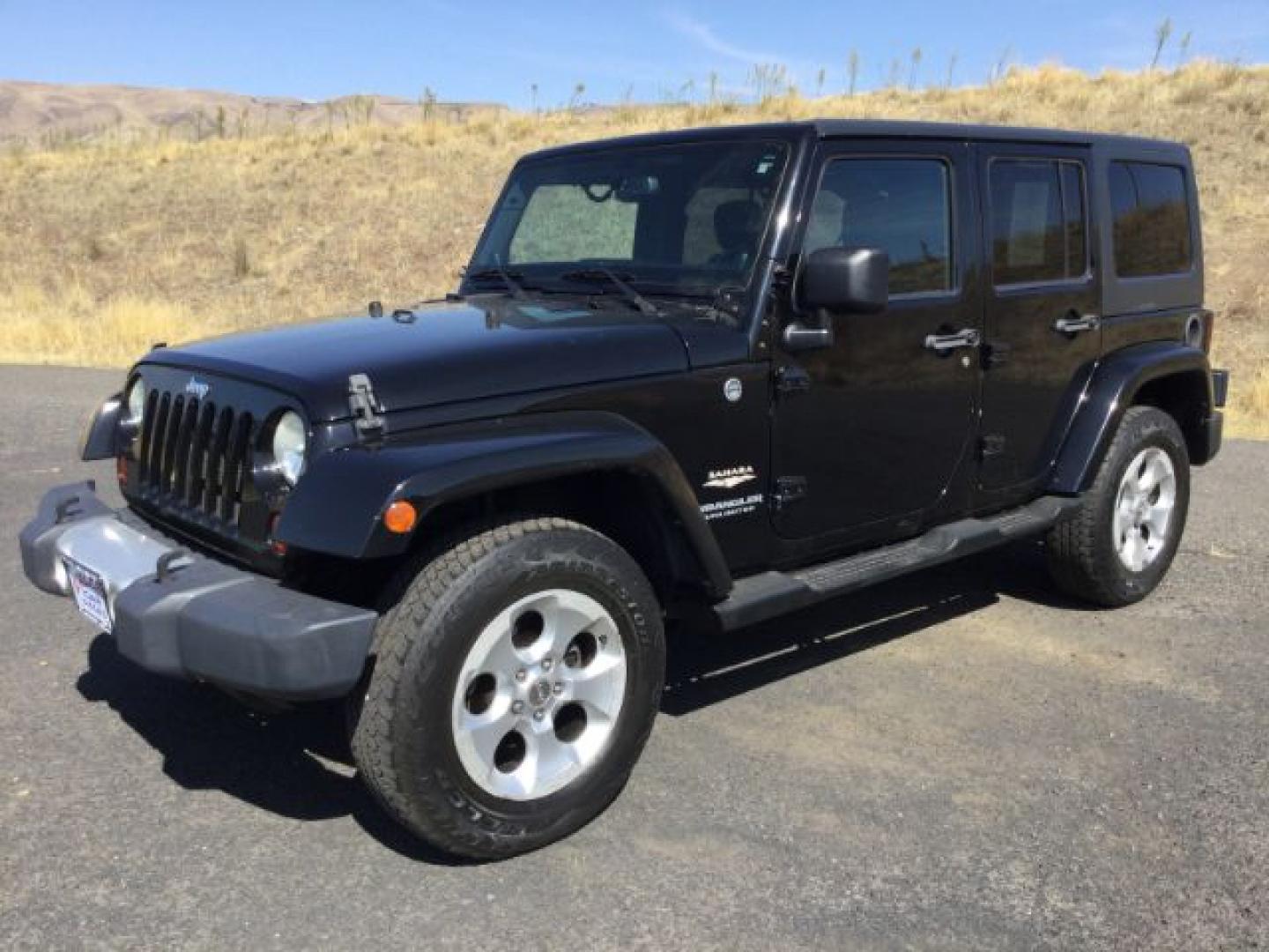 2013 Black /Black Jeep Wrangler Unlimited Sahara (1C4BJWEGXDL) with an 3.6L V-6 DOHC engine, 5-Speed Automatic transmission, located at 1801 Main Street, Lewiston, 83501, (208) 743-9371, 46.417065, -117.004799- Photo#0
