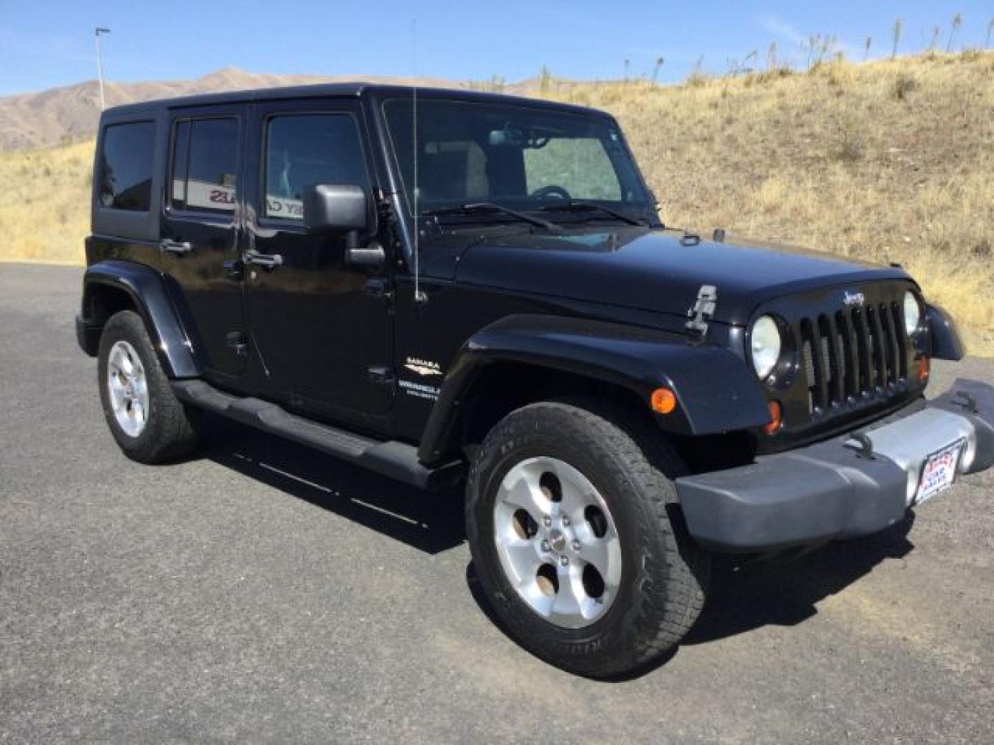 2013 Black /Black Jeep Wrangler Unlimited Sahara (1C4BJWEGXDL) with an 3.6L V-6 DOHC engine, 5-Speed Automatic transmission, located at 1801 Main Street, Lewiston, 83501, (208) 743-9371, 46.417065, -117.004799- Photo#2