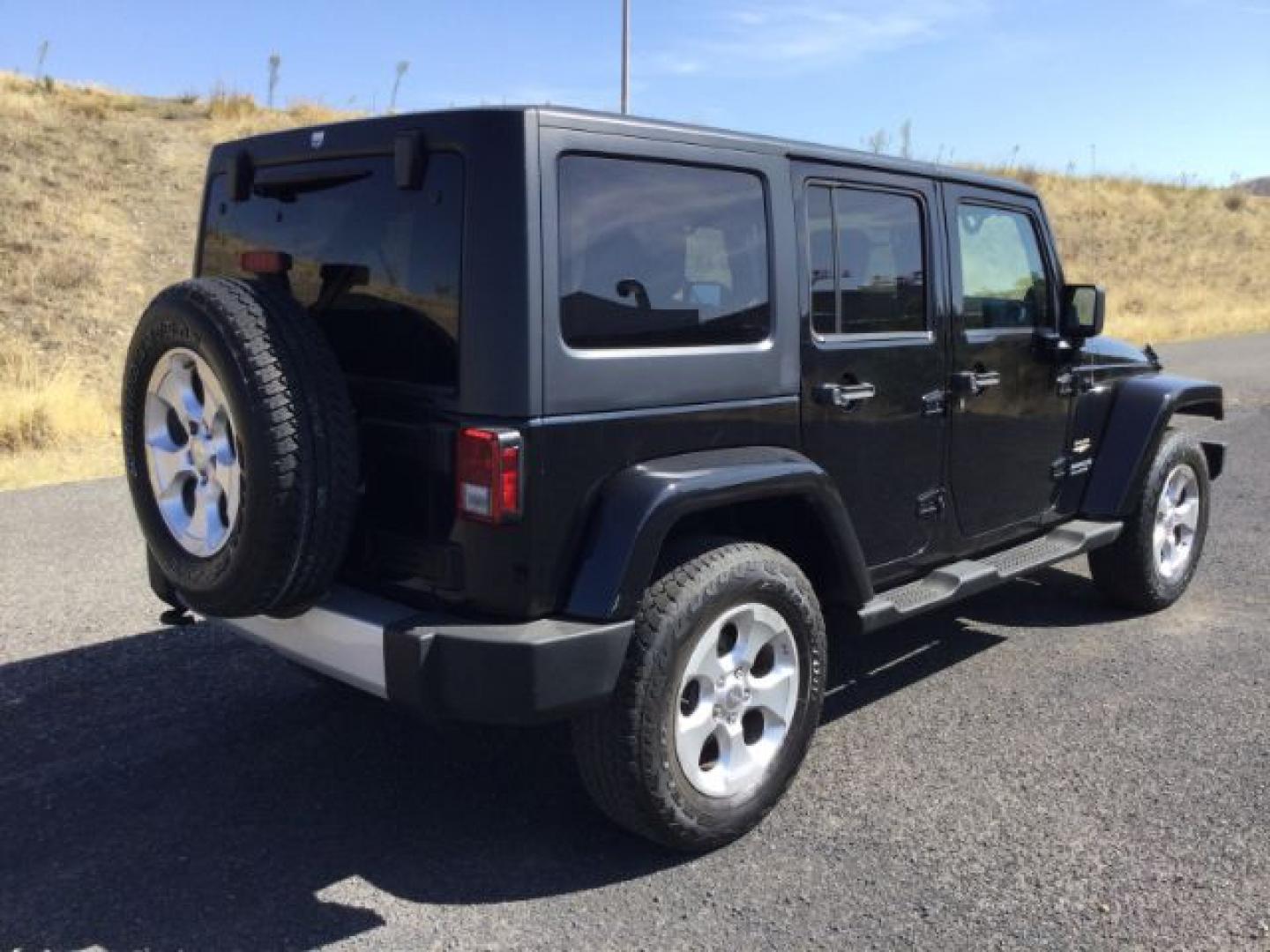 2013 Black /Black Jeep Wrangler Unlimited Sahara (1C4BJWEGXDL) with an 3.6L V-6 DOHC engine, 5-Speed Automatic transmission, located at 1801 Main Street, Lewiston, 83501, (208) 743-9371, 46.417065, -117.004799- Photo#9