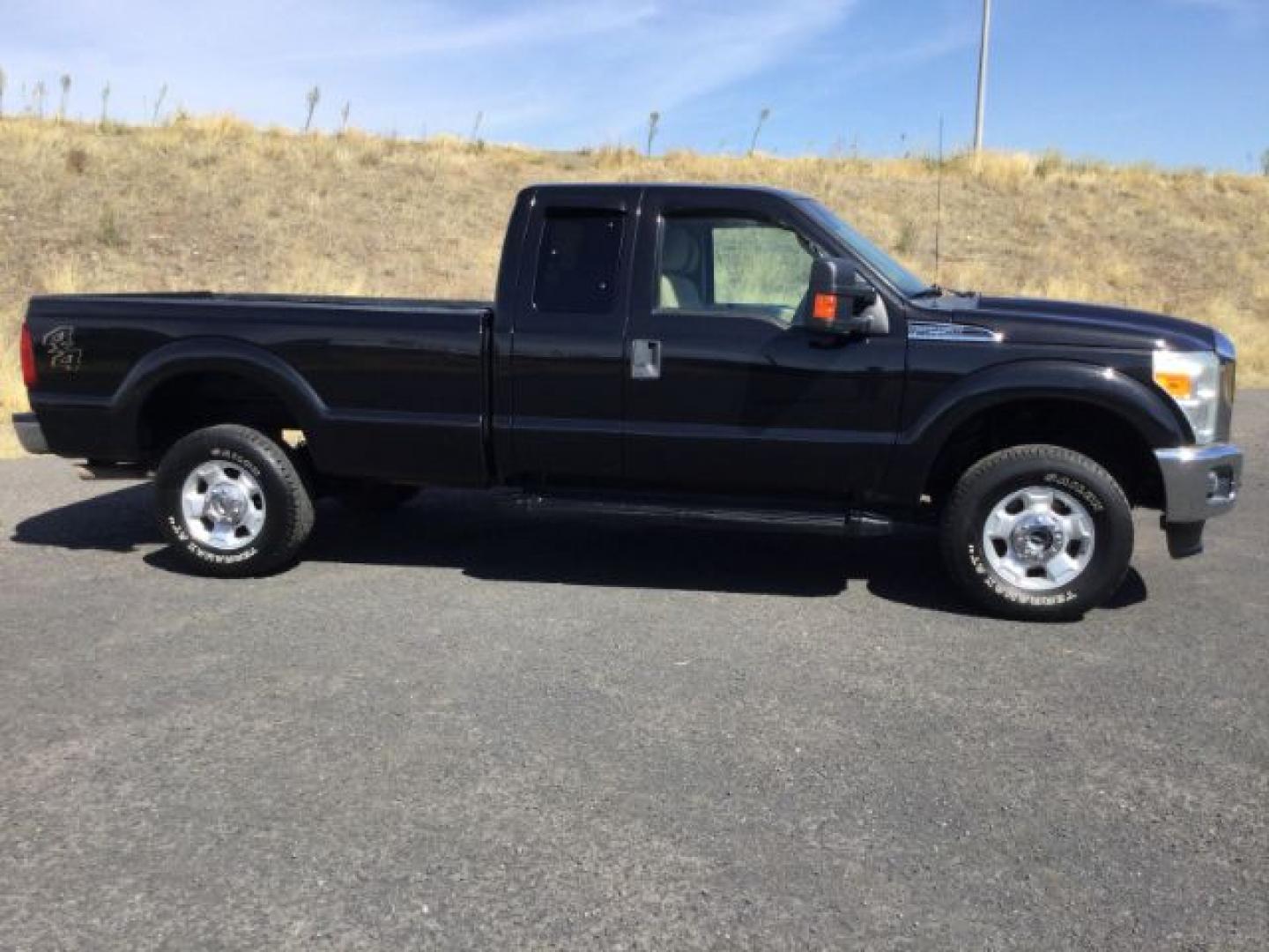 2011 Tuxedo Black Metallic /Adobe Cloth Ford F-250 Super Cab XLT 4x4 (1FT7X2B65BE) with an 6.2 EFI V8 engine, 6-Speed Automatic transmission, located at 1801 Main Street, Lewiston, 83501, (208) 743-9371, 46.417065, -117.004799- Photo#7