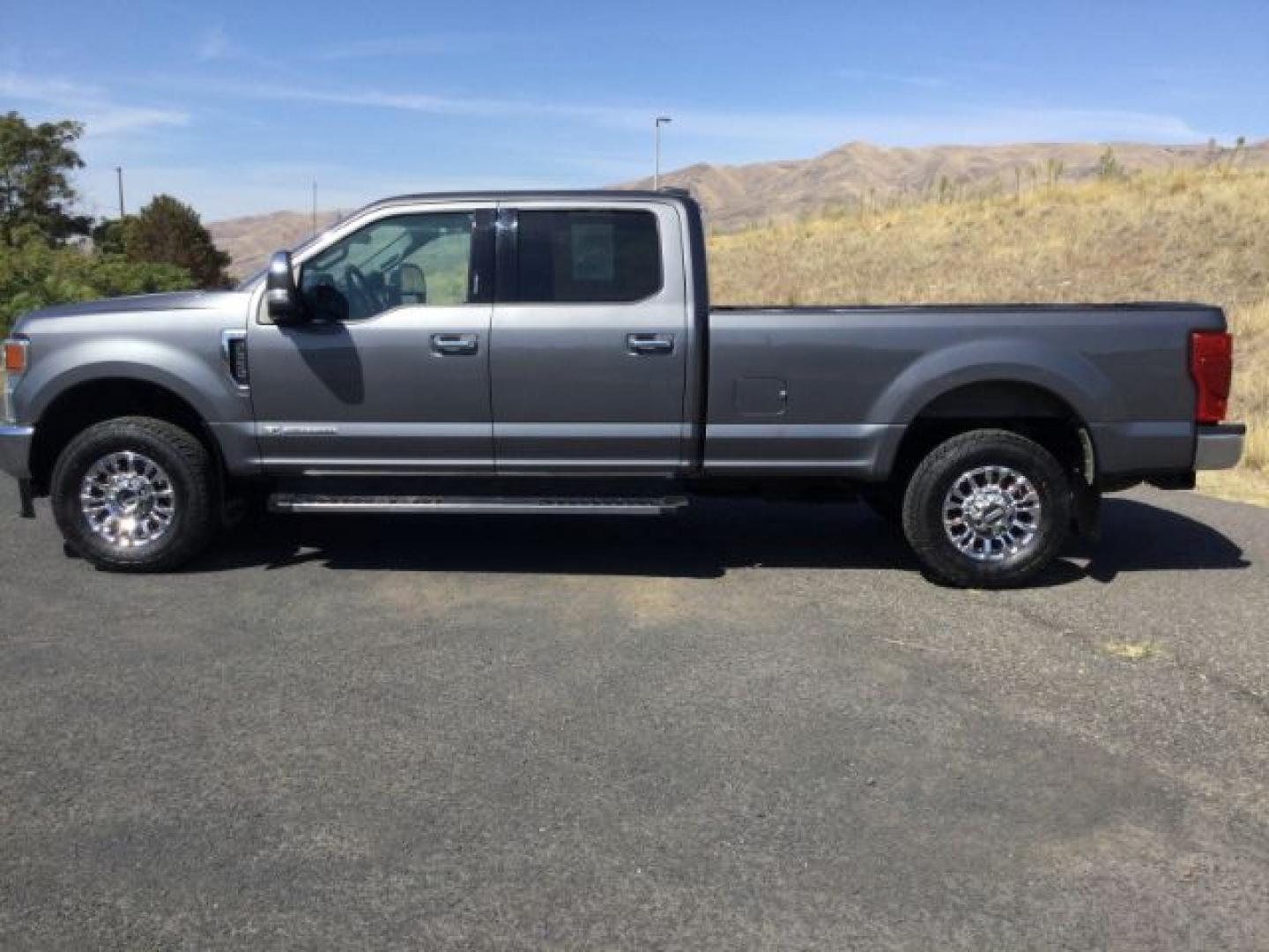 2022 Carbonized Gray Metallic /Medium Earth Gray Ford F-350 XLT Long Box (1FT8W3BT6NE) with an Powerstroke 6.7L V-8 direct injection engine, 10 speed automatic transmission, located at 1801 Main Street, Lewiston, 83501, (208) 743-9371, 46.417065, -117.004799- Photo#1