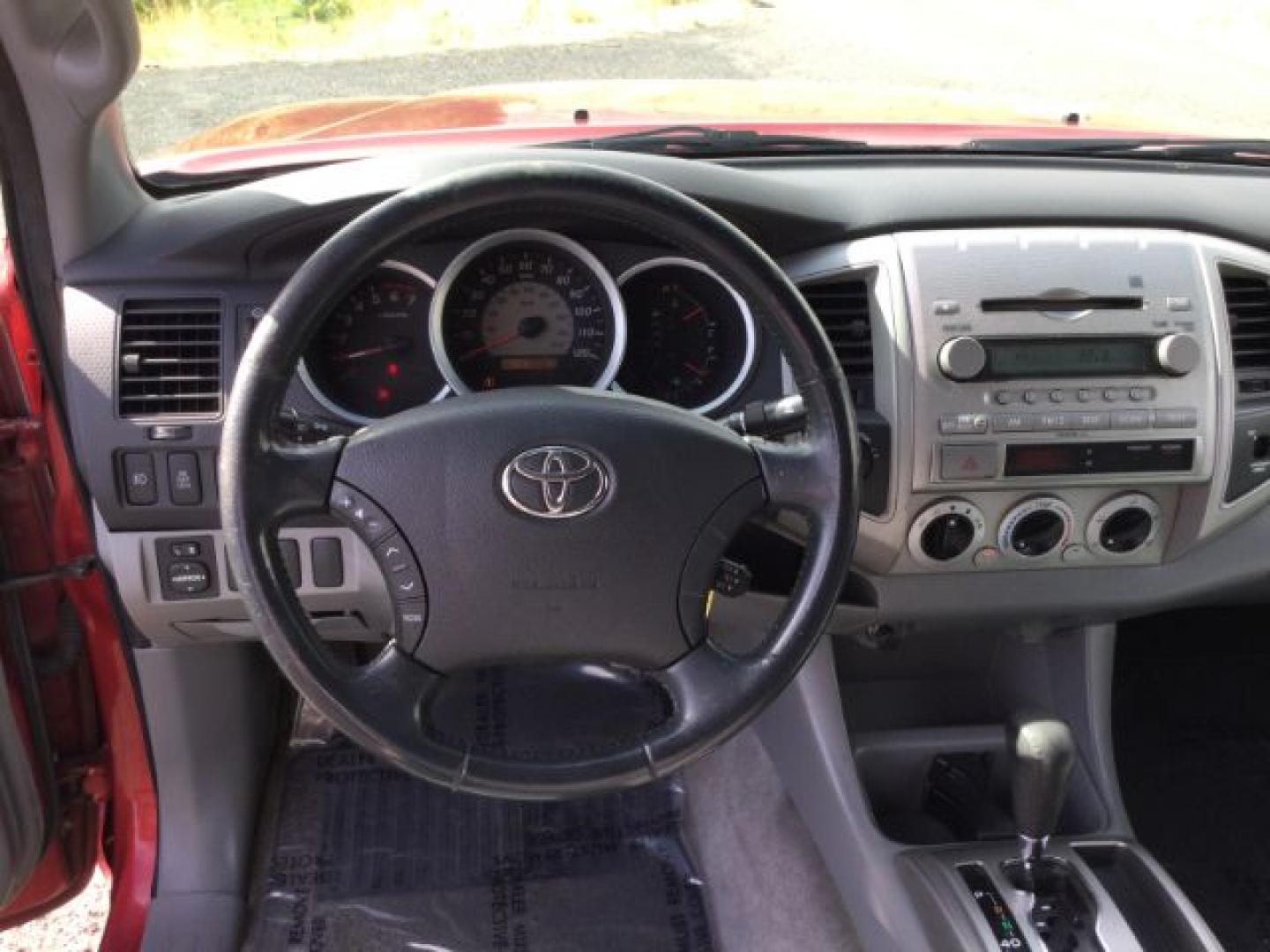 2006 Radiant Red /Graphite Toyota Tacoma Base V6 (5TEUU42N16Z) with an 4L V-6 DOHC engine, 5-Speed Automatic transmission, located at 1801 Main Street, Lewiston, 83501, (208) 743-9371, 46.417065, -117.004799- Photo#4