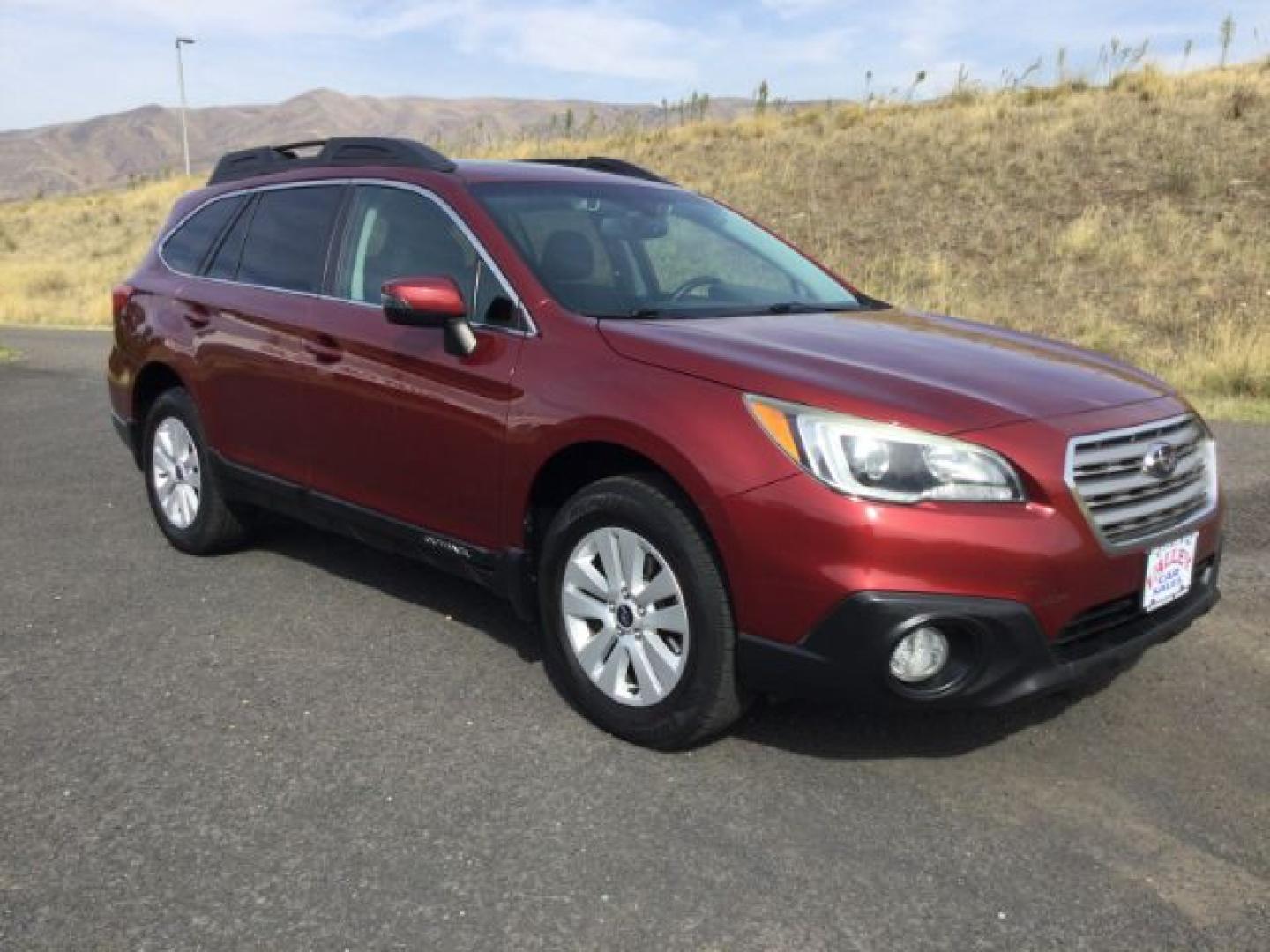 2015 Venetian Red Pearl /Slate Black Subaru Outback 2.5i Premium (4S4BSAHC4F3) with an 2.5L H-4 DOHC engine, Continuously Variable Transmission transmission, located at 1801 Main Street, Lewiston, 83501, (208) 743-9371, 46.417065, -117.004799- Photo#1