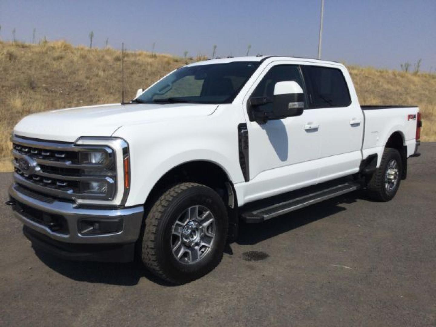 2023 Oxford White /Black Onyx Ford F-350 LARIAT (1FT8W3BN5PE) with an 7.3L V-8 DEVCT variable valve control engine, 10 speed automatic transmission, located at 1801 Main Street, Lewiston, 83501, (208) 743-9371, 46.417065, -117.004799- Photo#0