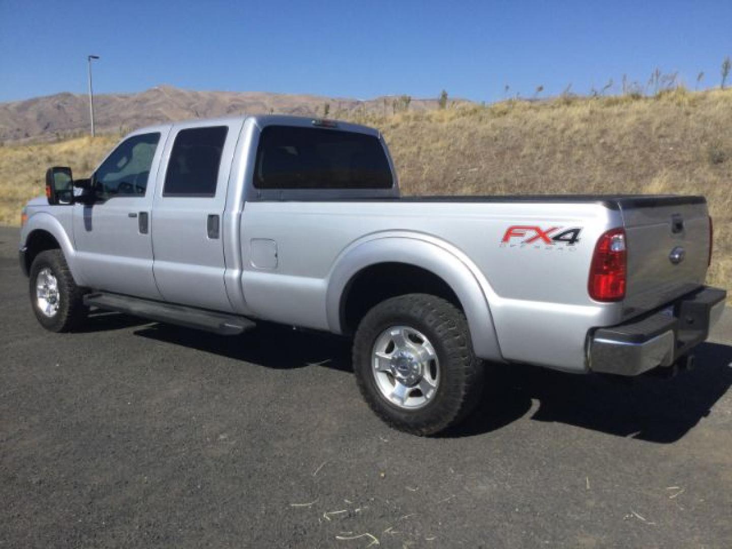 2015 Ingot Silver Metallic /Steel Gray Cloth Ford F-250 XLT (1FT7W2B65FE) with an 6.2 EFI V8 engine, 6-Speed Automatic transmission, located at 1801 Main Street, Lewiston, 83501, (208) 743-9371, 46.417065, -117.004799- Photo#2